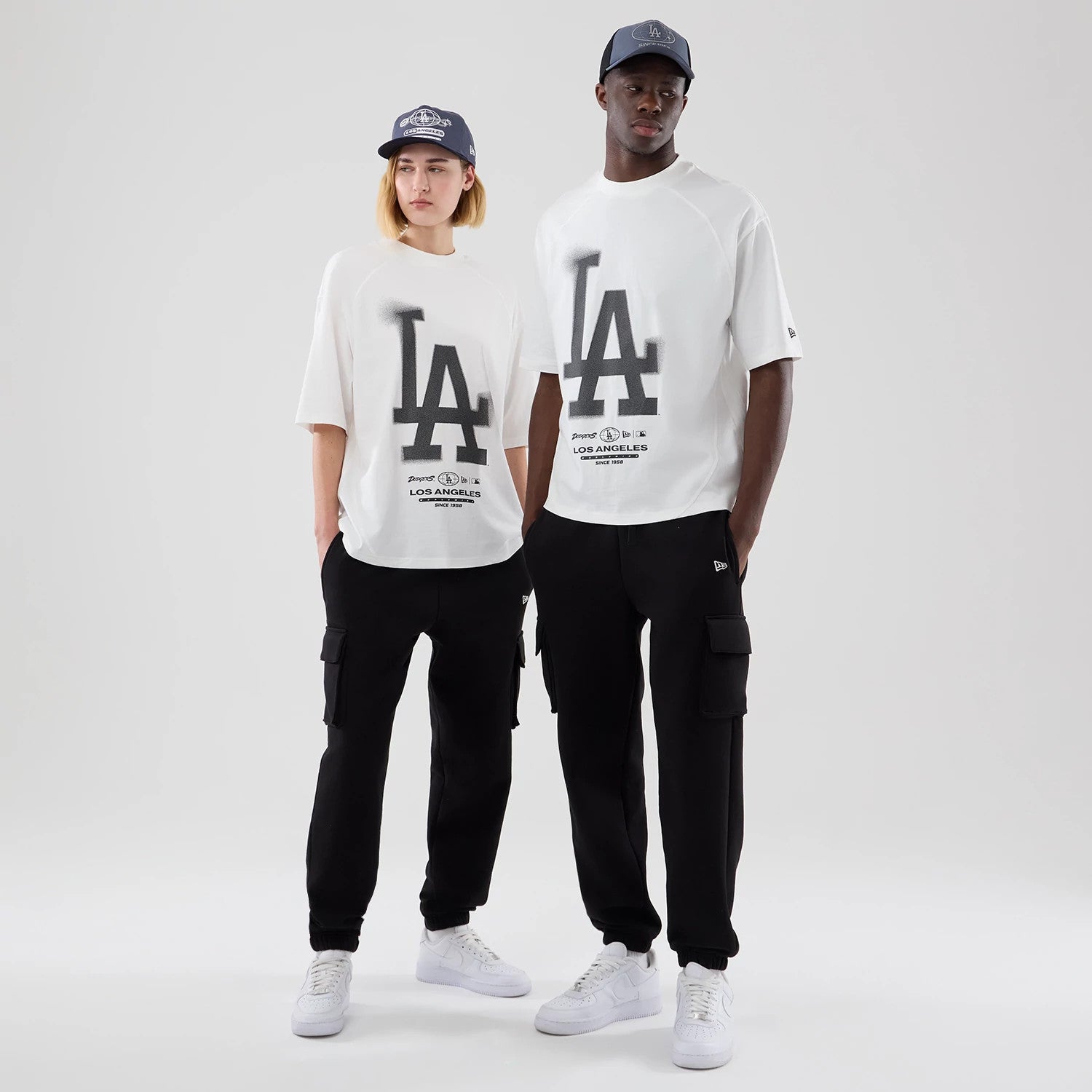 The model is wearing this MLB Graphic LA Dodgers Boxy T-Shirt in white. 1