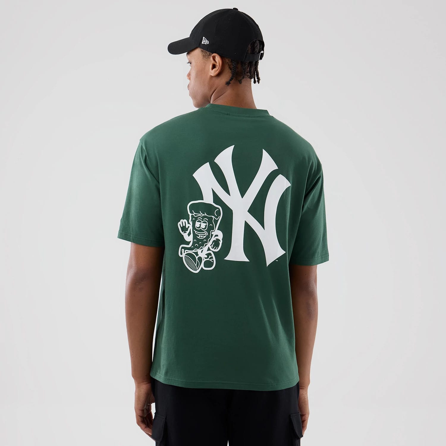The model is wearing this MLB Food Graphic New York Yankees Oversized T-Shirt in dark green. 2