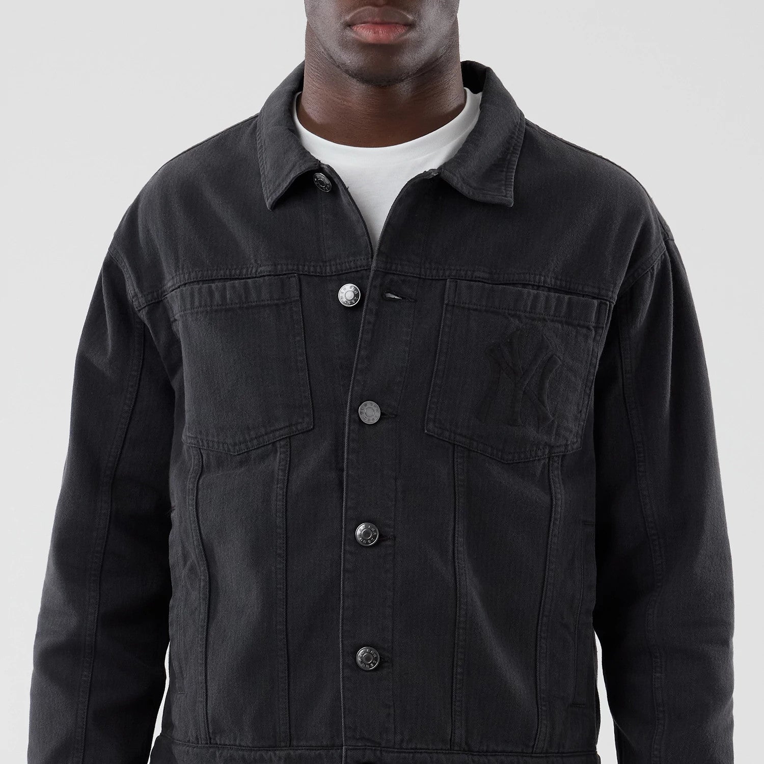 The model is wearing this MLB Stripe Denim New York Yankees Jacket in grey. 3