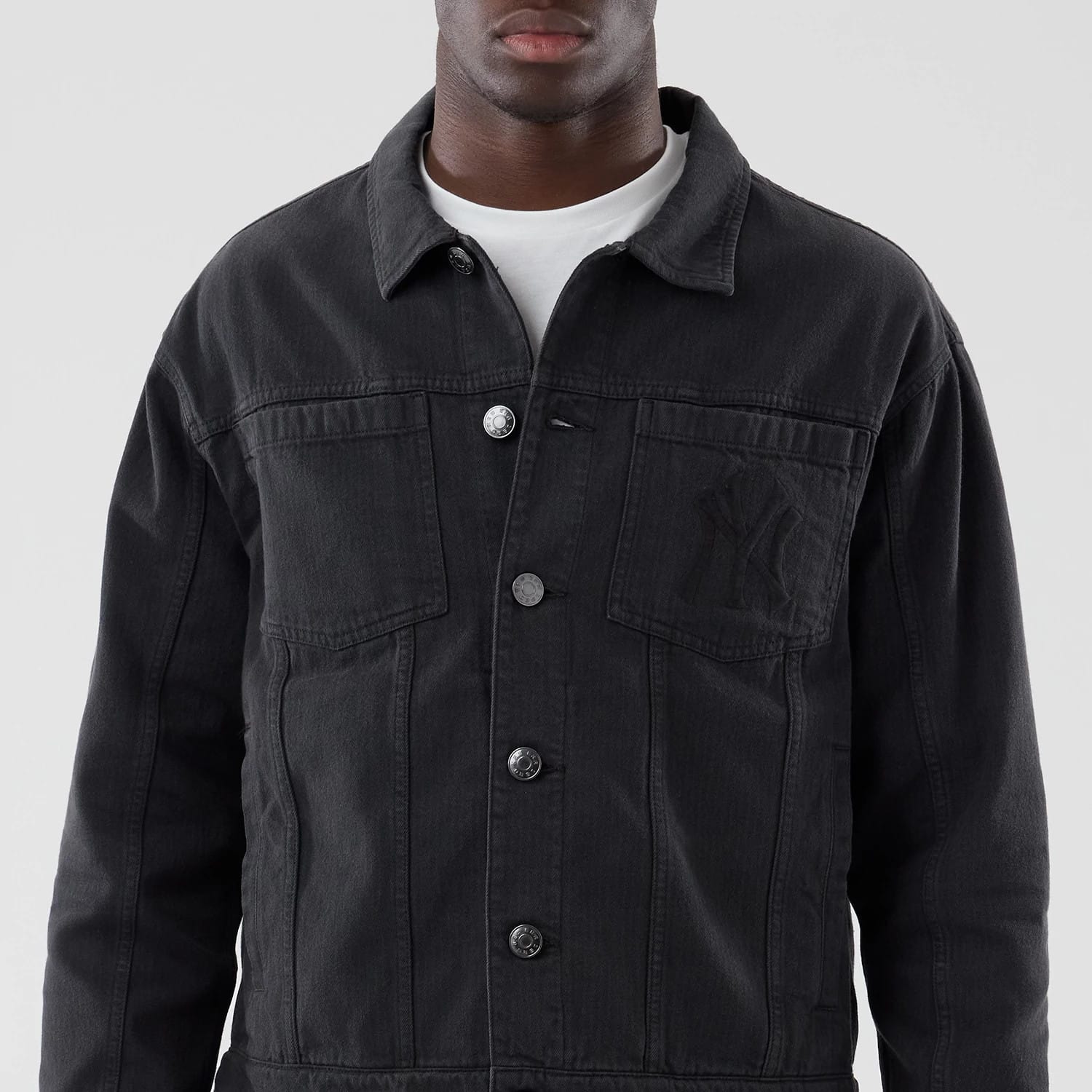 The model is wearing this MLB Stripe Denim New York Yankees Jacket in grey. 3