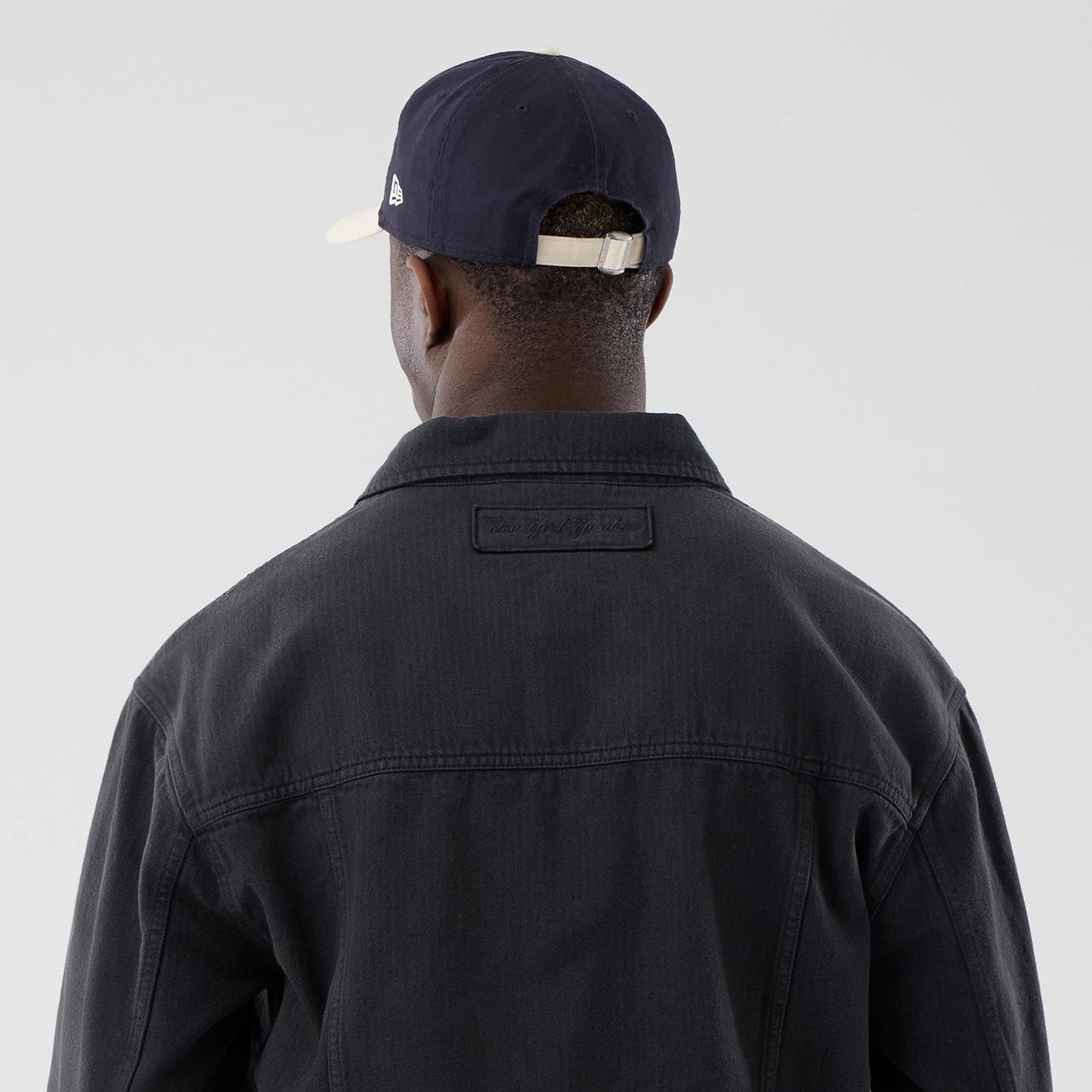 The model is wearing this MLB Stripe Denim New York Yankees Jacket in grey. 7