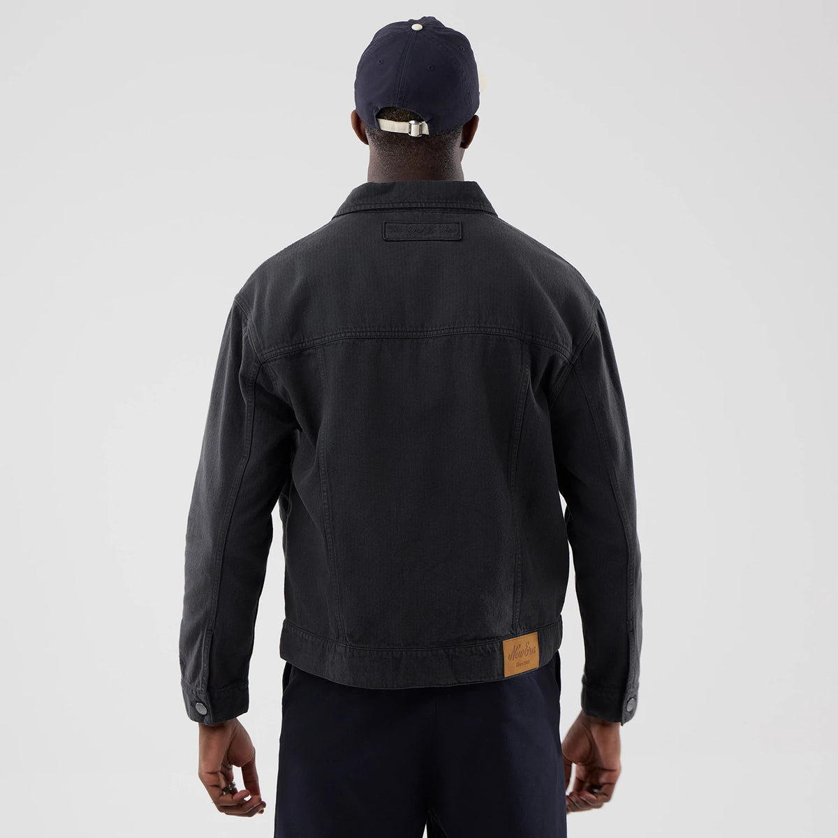 The model is wearing this MLB Stripe Denim New York Yankees Jacket in grey. 2