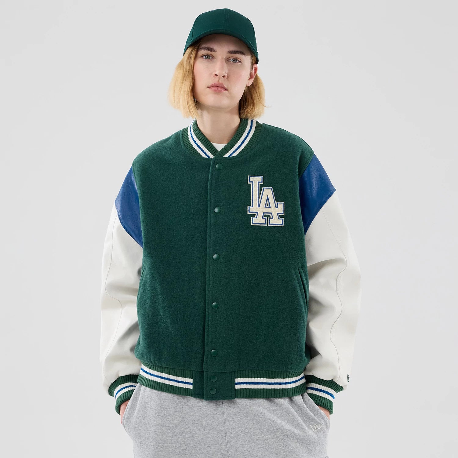 The model is wearing this MLB Varsity LA Dodgers Jacket in dark green. 4