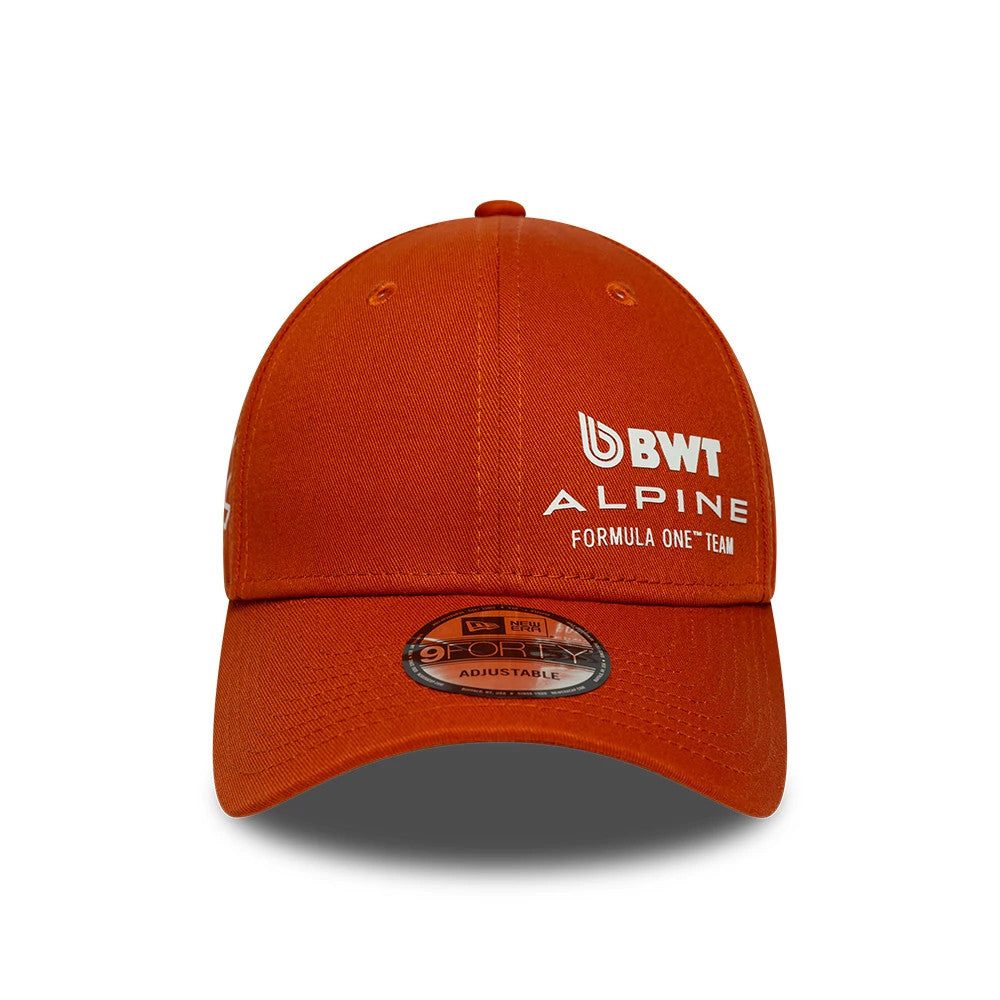Alpine Racing Sidehit Red New Era 9FORTY Adjustable Cap, front view showing the white BWT Alpine Formula One Team logo embroidered on the front panel, with eyelets on the crown and a 9FORTY size sticker on the red curved visor.