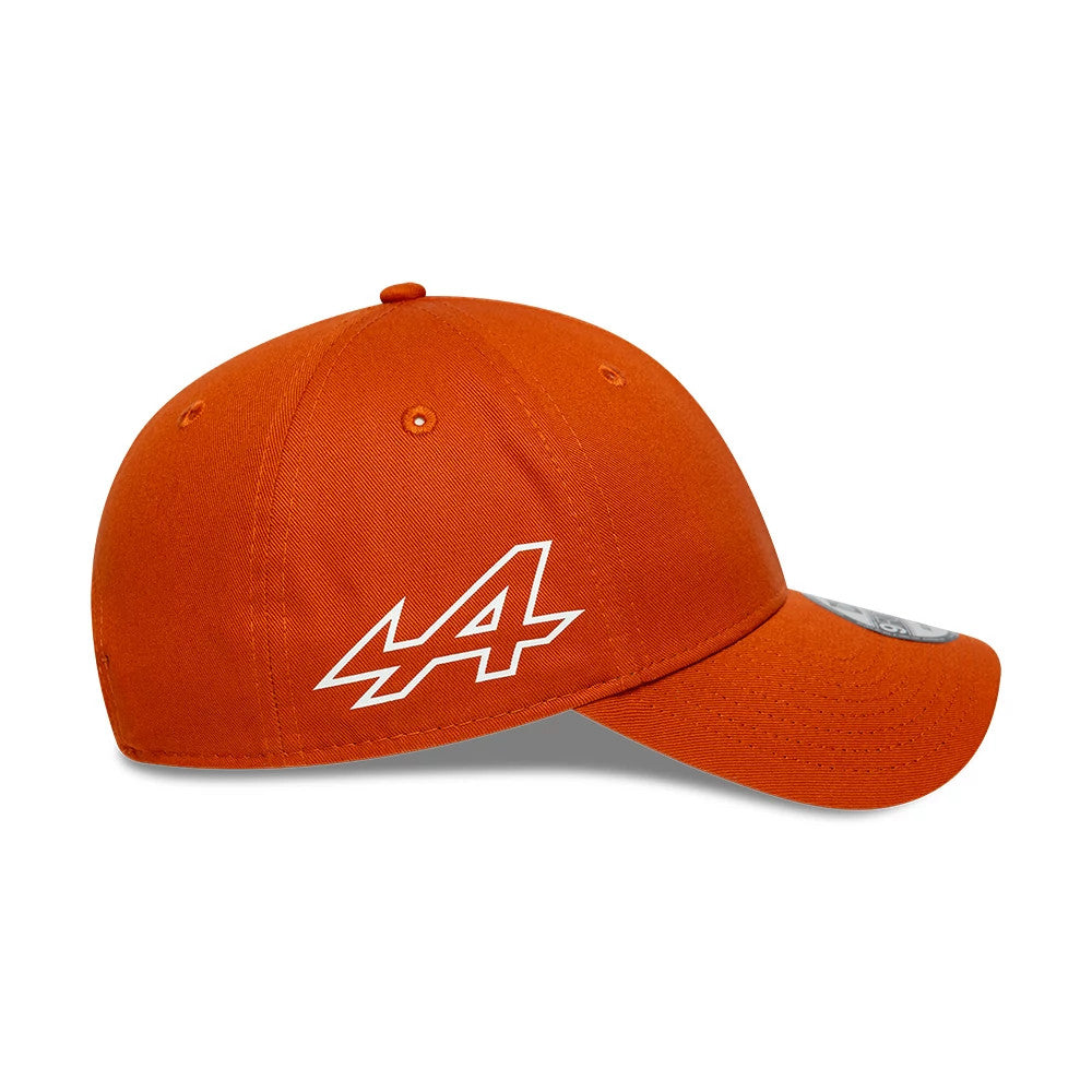 Alpine Racing Sidehit Red New Era 9FORTY Adjustable Cap, side view showing the white A logo embroidered on the structured red crown, with matching red curved visor and 9FORTY size sticker on top of the visor.