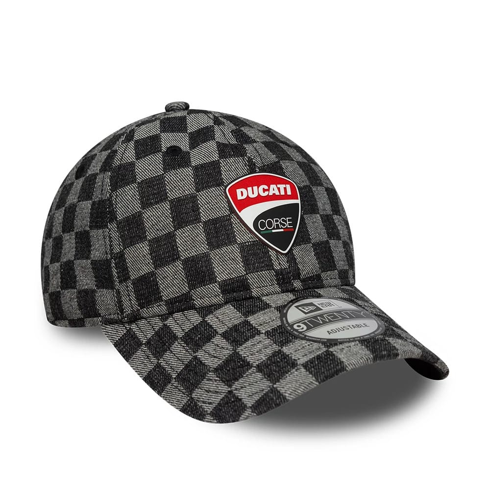 Ducati Motor All Over Print Black New Era 9TWENTY Adjustable Cap, three-quarter view showing the red and white Ducati Corse logo embroidered on the front panel, with a black and grey checkered pattern.