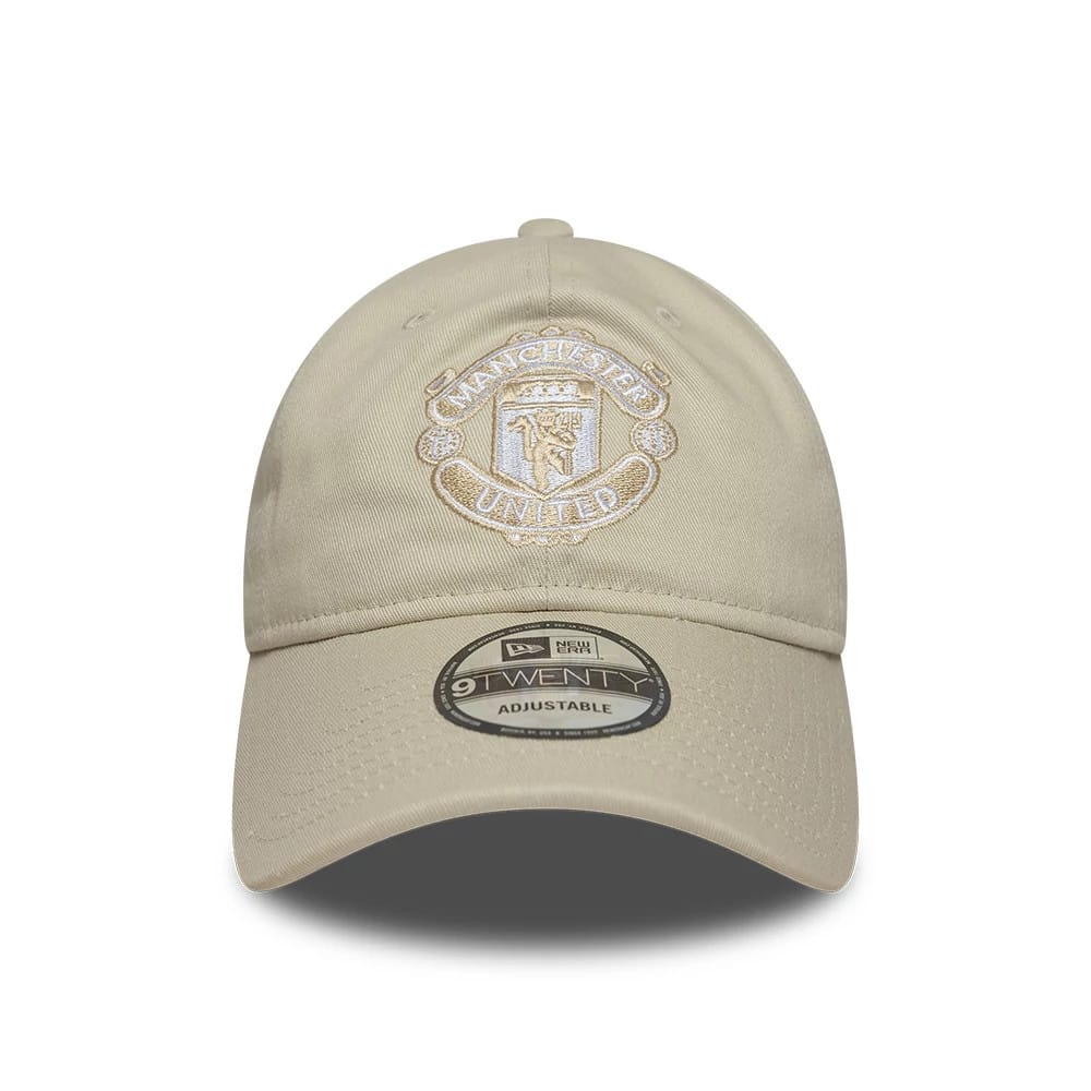 Manchester United FC Cream New Era 9TWENTY Adjustable Cap, front view showing the cream embroidered club crest on the unstructured crown, with a curved visor and a 9TWENTY size sticker centrally placed.