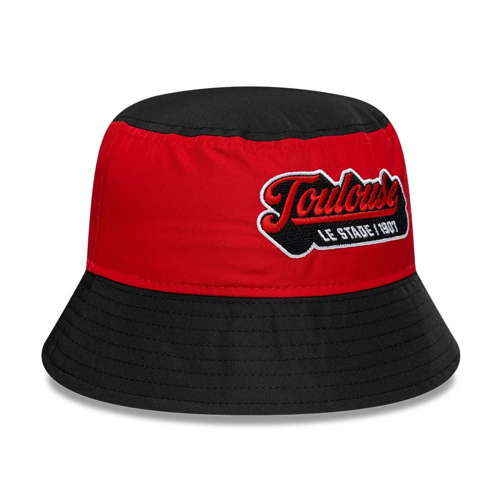New Era Youth Stade Toulousain Black Bucket Hat, front view showing the red embroidered Toulouse script logo with Le Stade 1907 detail on the front panel, contrasted against the black crown and matching black visor of the hat.