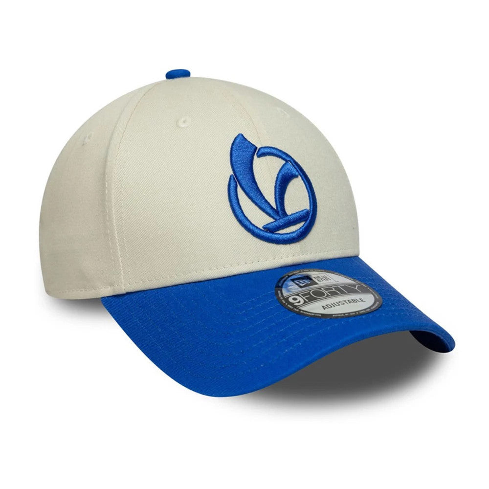 Vespa Contrast Visor Bright Blue New Era 9FORTY Adjustable Cap, three-quarter view showing the raised blue Vespa logo embroidered on the cream front panel, with a blue curved visor and a 9FORTY size sticker placed on top.