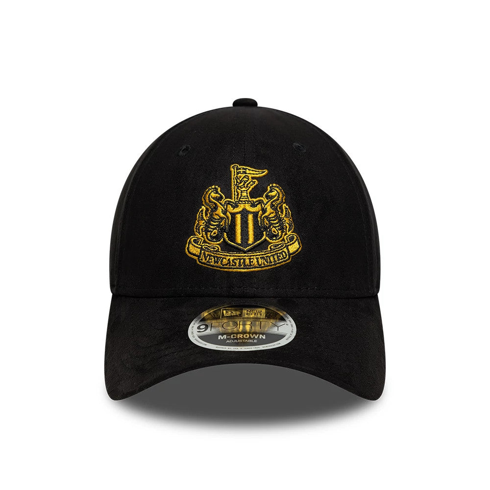 Newcastle United FC Faux Suede Black New Era 9FORTY M-Crown Adjustable Cap, front view showing the gold embroidered Newcastle United crest on the structured black faux suede crown, with a curved visor and 9FORTY size sticker on the visor.