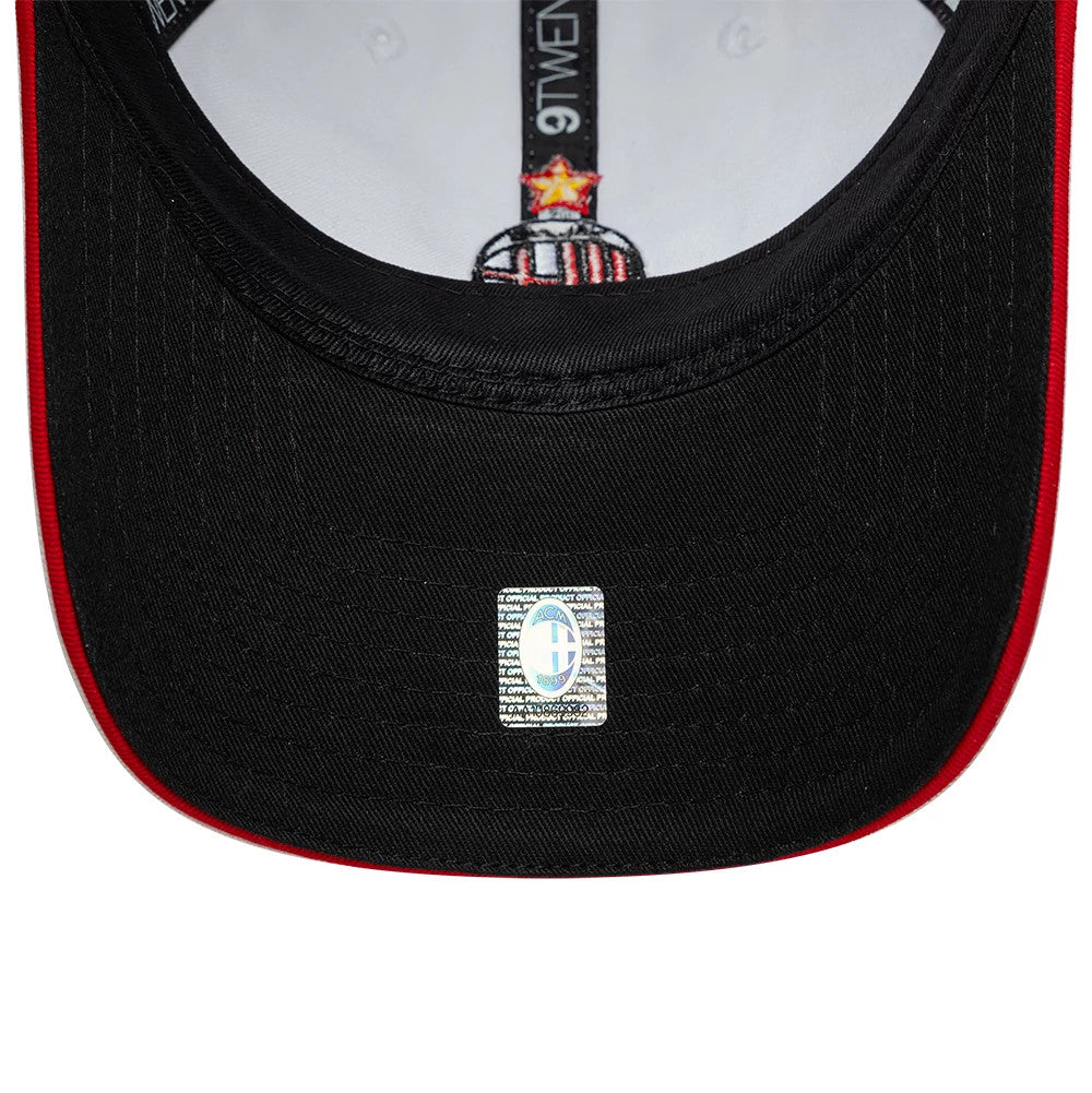 AC Milan 96 White New Era 9TWENTY Adjustable Cap, inside view showing the black under visor with a round sticker, white interior lining with black 9TWENTY and AC Milan tape, featuring red accents on the edge of the visor.