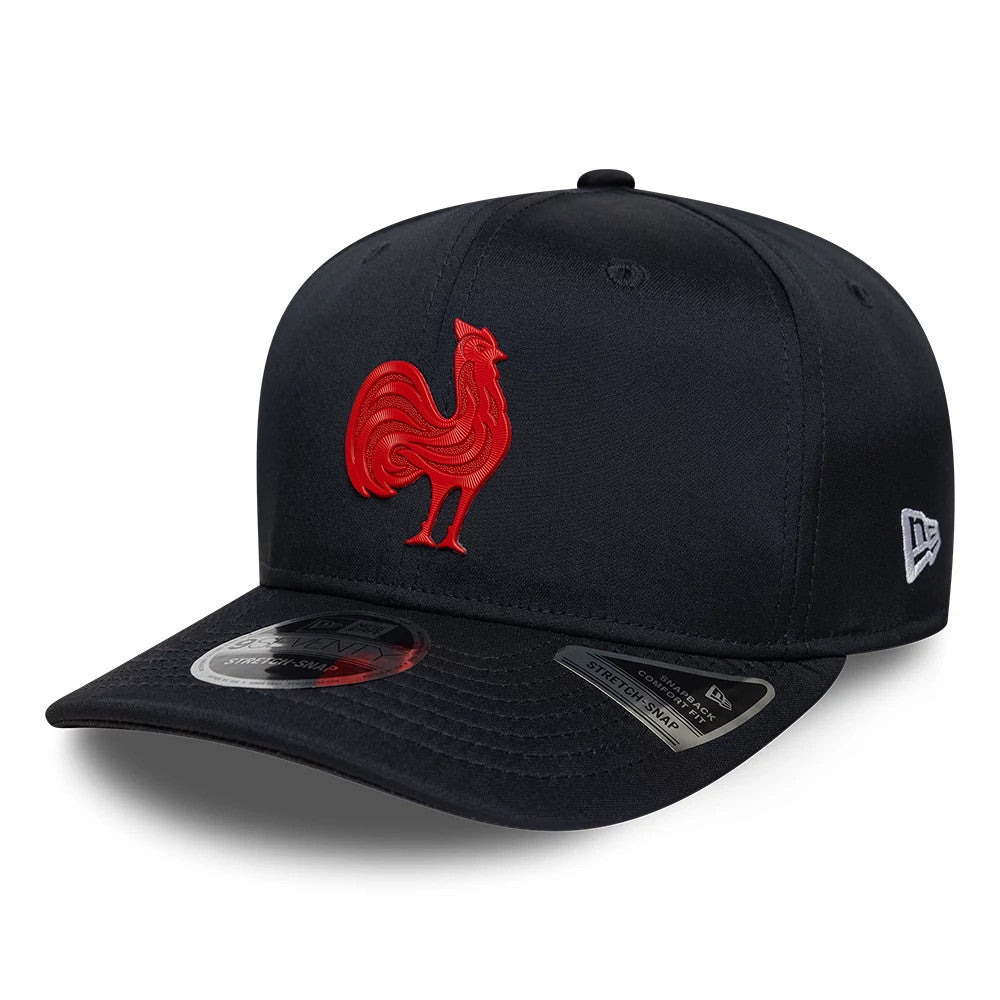 French Federation Of Rugby Kit Navy New Era 9SEVENTY Stretch Snap Adjustable Cap, front view showing the prominent red embroidered rooster logo on the structured navy crown, with a curved visor and the New Era flag logo on the left side.