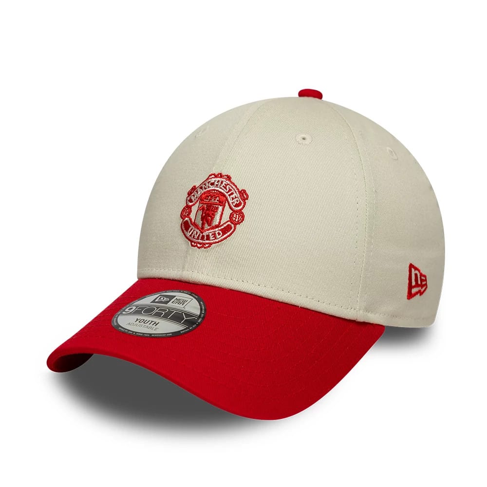 Pictured is this Youth Manchester United FC Contrast 9FORTY cap in cream. 1