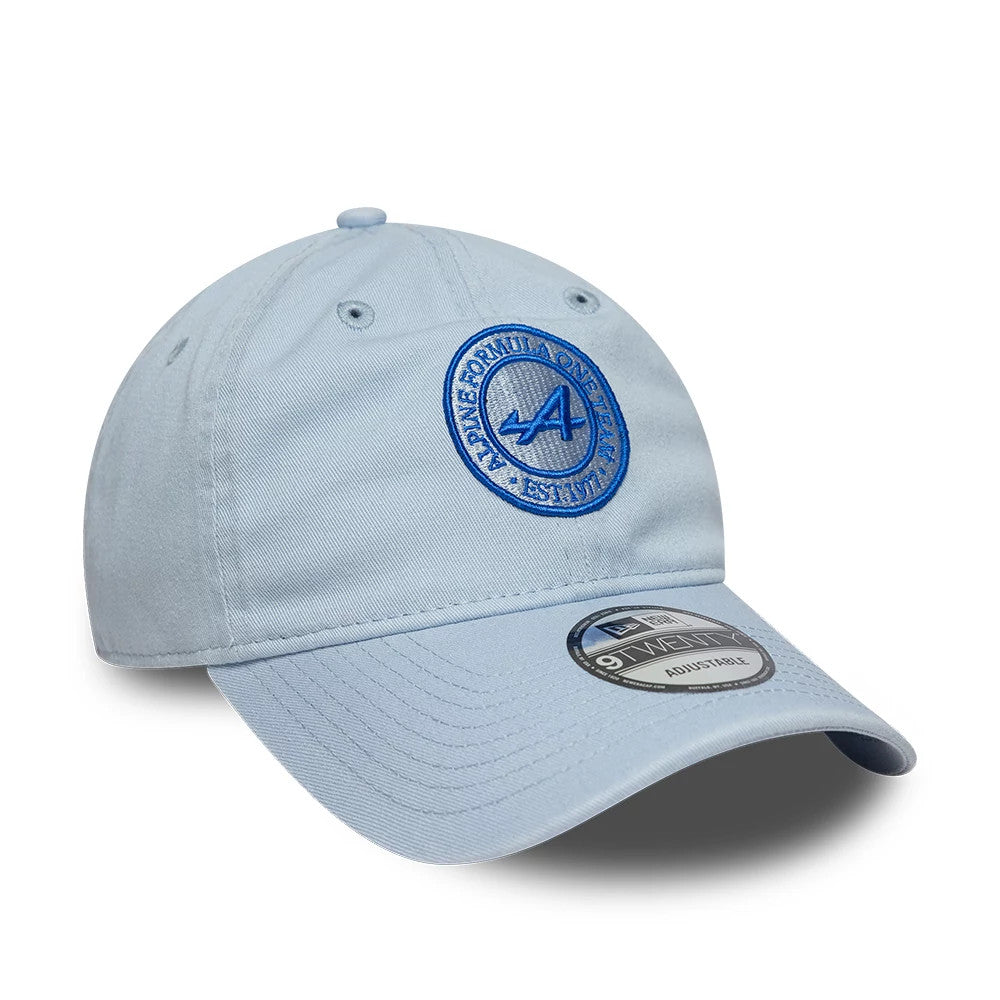 Alpine Racing Heritage Logo Blue New Era 9TWENTY Adjustable Cap, three-quarter view showing the blue embroidered Alpine logo on the front panel, curved blue visor, and 9TWENTY size sticker on the visor.
