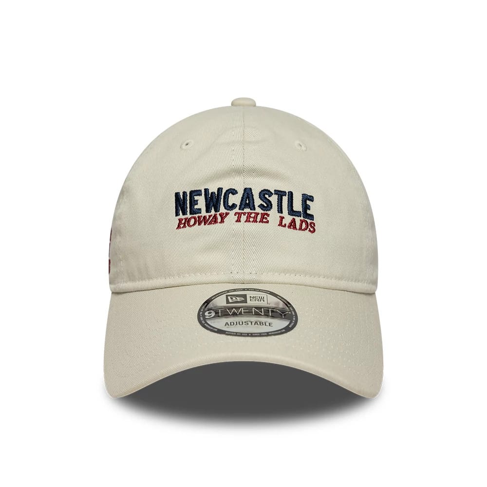 Newcastle United FC Howay The Lads Cream New Era 9TWENTY Adjustable Cap, front view showing the navy and red embroidered team name and slogan central on the crown, with a curved bill featuring a 9TWENTY size sticker.