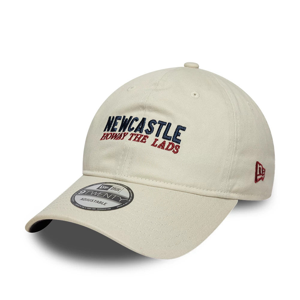 Newcastle United FC Howay The Lads Cream New Era 9TWENTY Adjustable Cap, front view showing the navy and red embroidered text on the structured cream crown, a 9TWENTY size sticker on the visor, and the New Era flag logo on the left side.