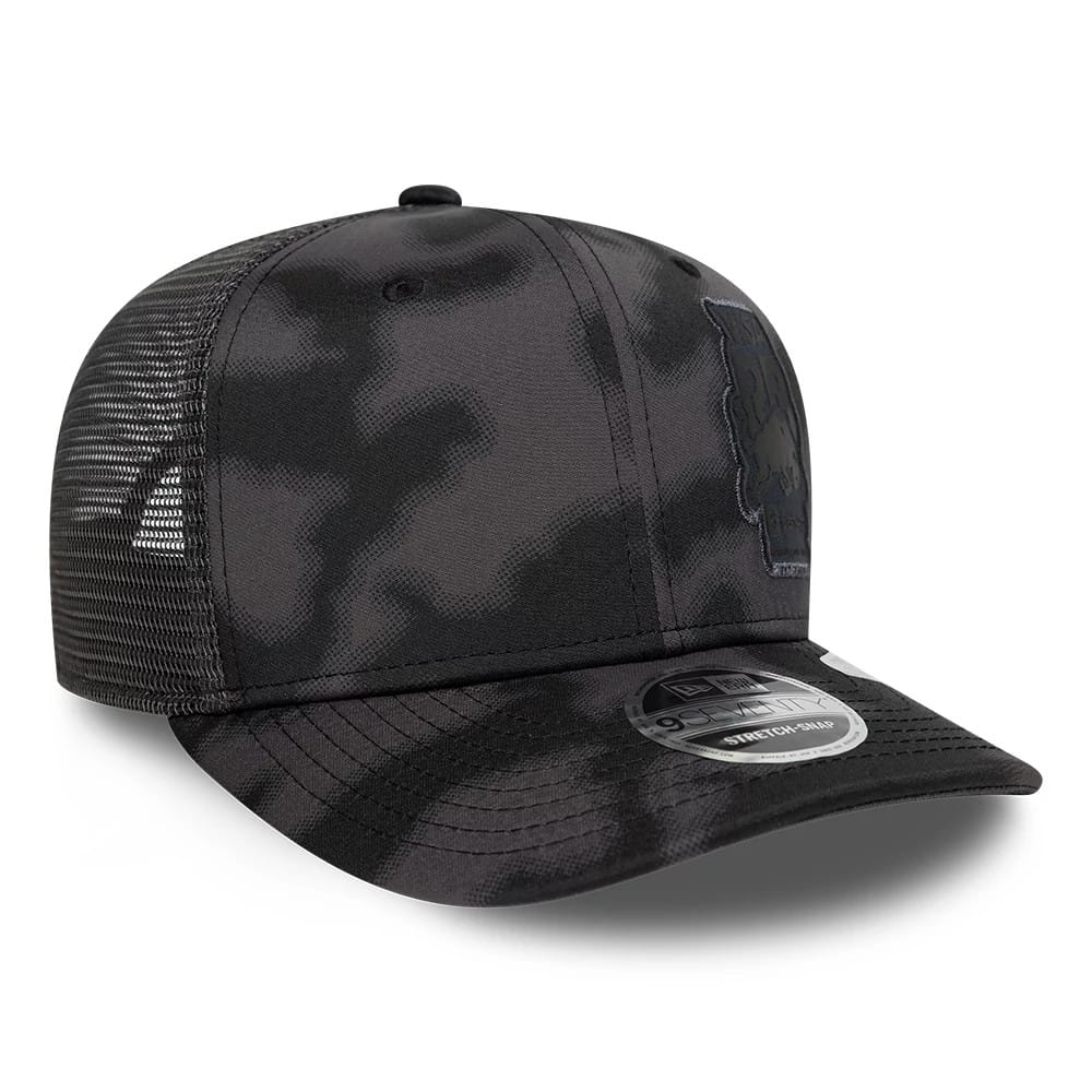 Visa Cash App Racing Bulls All Over Black New Era 9SEVENTY Stretch Snap Adjustable Cap, three-quarter view showing the black-on-black embroidered Racing Bulls logo on the front panel, curved black visor with a 9SEVENTY size sticker.