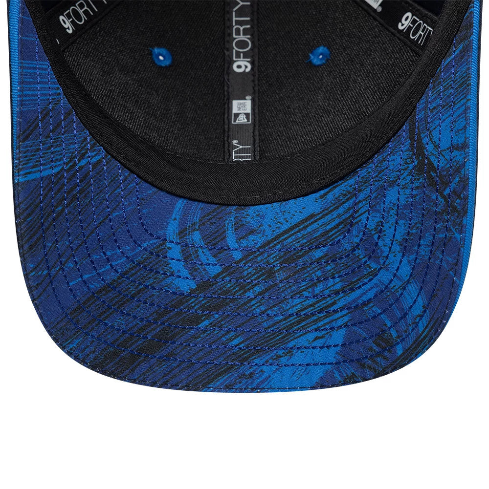 Williams Team Navy New Era 9FORTY M-Crown Adjustable Cap, inside view showing the blue patterned undervisor with swirling black designs, black sweatband featuring the 9FORTY logo, and taping with New Era brand details.
