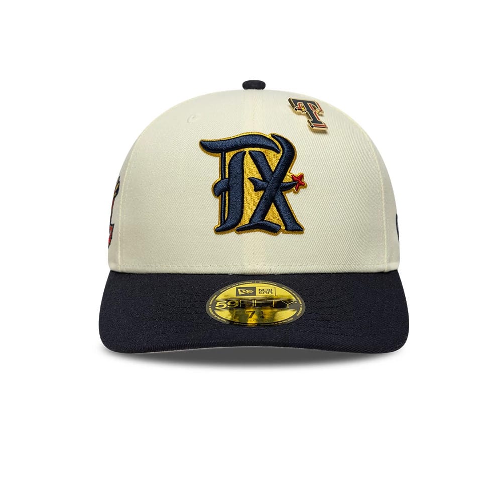 Texas Rangers MLB Pin Cream & Navy New Era 59FIFTY Fitted Cap, front view showing a large navy embroidered TX logo with gold outline on the cream crown, a matching pin on the right panel, and a gold 59FIFTY size sticker on the navy visor.