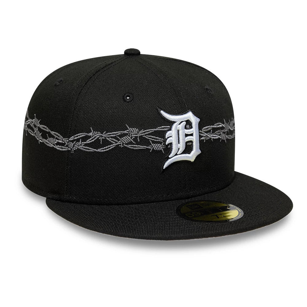 Detroit Tigers MLB Icon Black New Era 59FIFTY Fitted Cap, three-quarter view showing a white embroidered D logo on the front panel, grey barbed wire embroidery wrapping around the black crown, and a gold 59FIFTY size sticker on the flat visor.