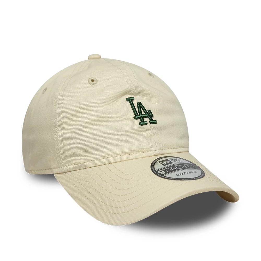 LA Dodgers MLB Mini Logo Cream New Era 9TWENTY Adjustable Cap, front view showing the green embroidered LA logo on the cream unstructured crown, with a curved visor and a 9TWENTY size sticker on the visor.