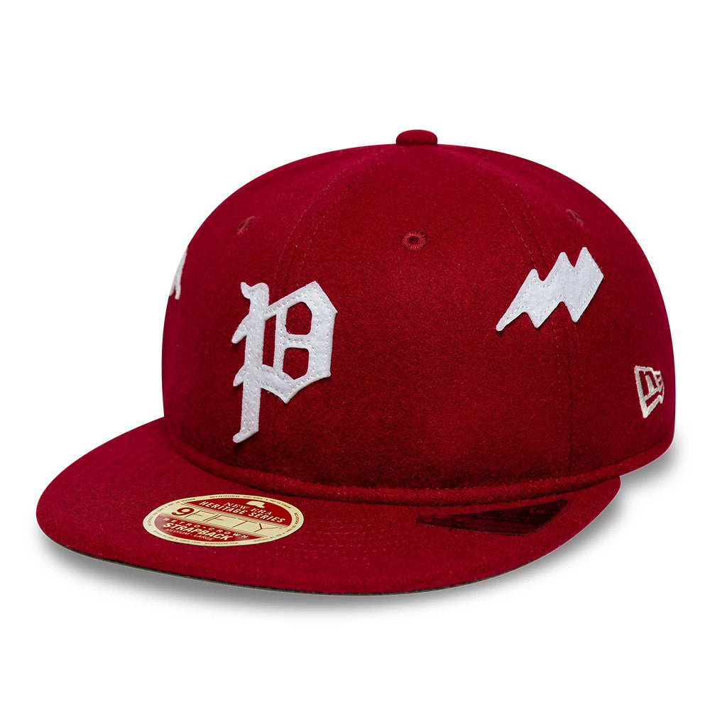 Phillies MLB Heritage Dark Red Retro Crown New Era 9FIFTY Adjustable Cap, front view showing the white embroidered P logo on the centre front panel, white lightning bolt on the right panel, and gold 9FIFTY size sticker on the flat dark red visor.