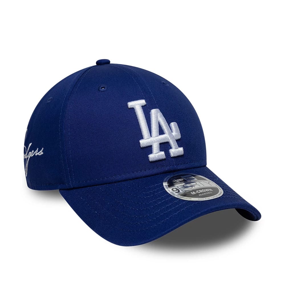 Pictured is this MLB Side Script LA Dodgers 9FORTY M-Crown cap in dark blue. 1