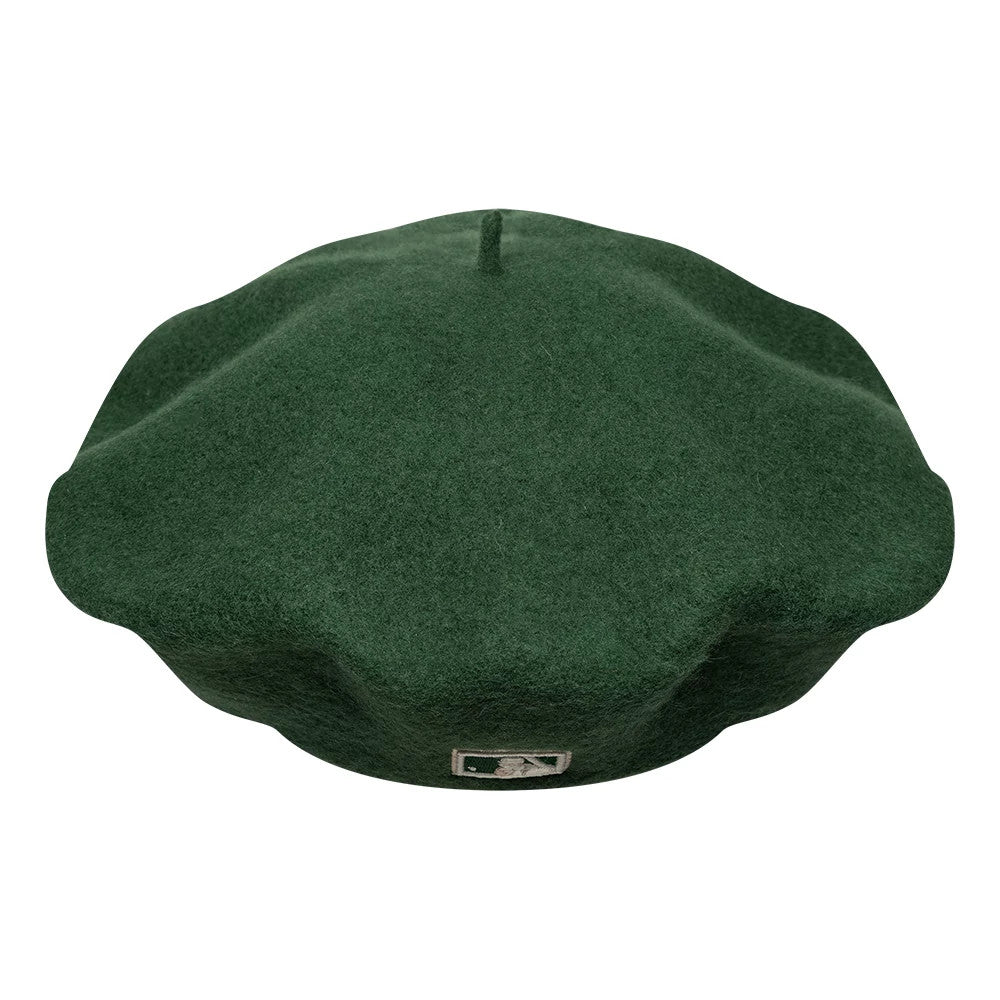 New Era New York Yankees MLB Cooperstown Pin Dark Green Beret, top view showcasing the classic round shape with a soft crown, a small protruding stem at the centre, and an embroidered MLB logo patch at the rear base of the dark green beret.
