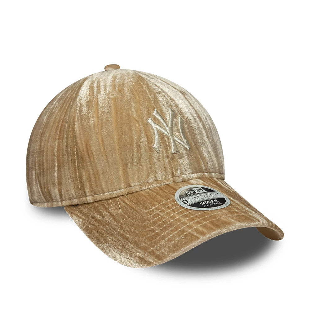 New York Yankees Womens MLB Velour Beige New Era 9TWENTY Adjustable Cap, three-quarter view showing the white embroidered NY logo on the front panel, a glossy 9TWENTY size sticker on the curved visor, and a textured velour finish on the crown.