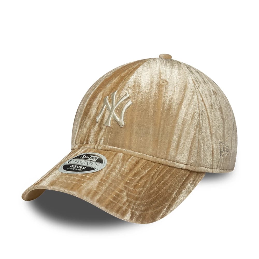 New York Yankees Womens MLB Velour Beige New Era 9TWENTY Adjustable Cap, three-quarter view showing the cream embroidered Yankees logo on the front panel, velour texture throughout, and a 9TWENTY size sticker on the curved visor.