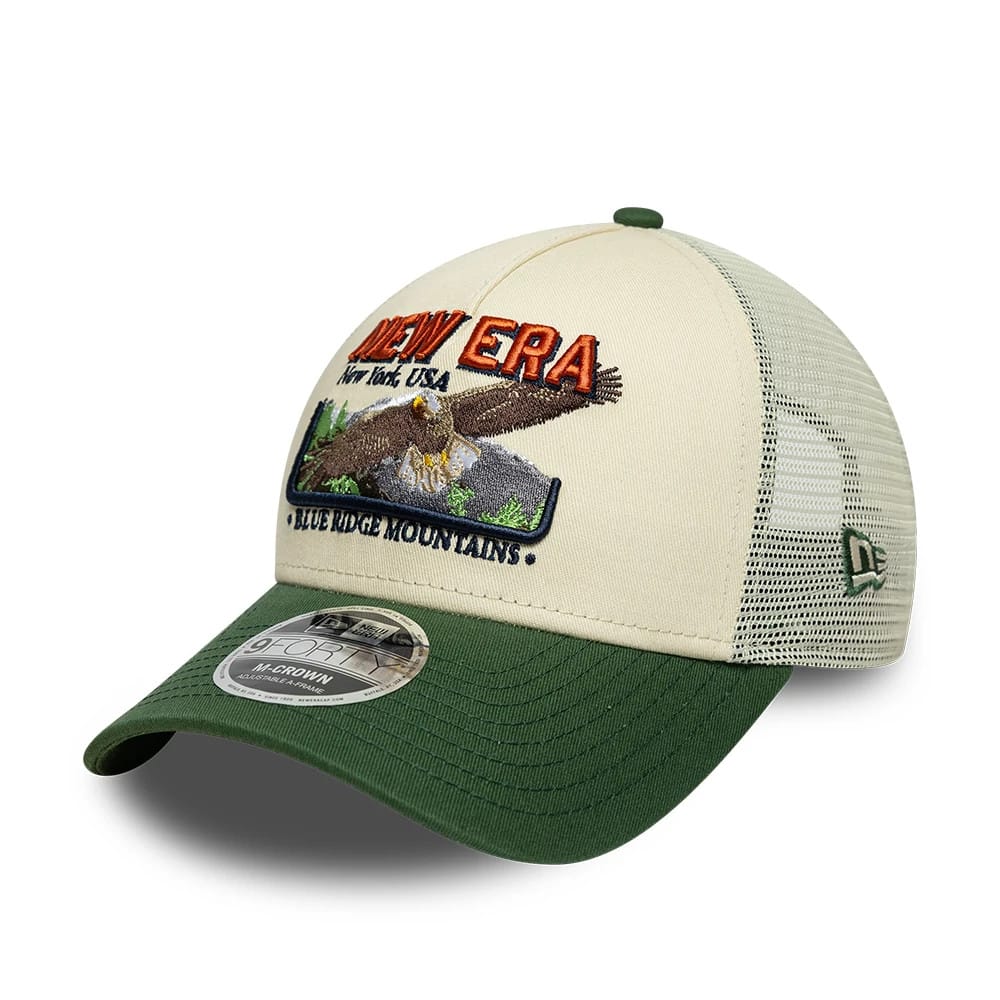 Pictured is this New Era Graphic 9FORTY M-Crown A-Frame Trucker cap in cream & green. 1