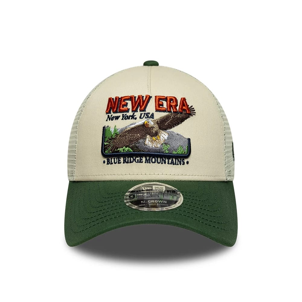 Pictured is this New Era Graphic 9FORTY M-Crown A-Frame Trucker cap in cream & green. 2