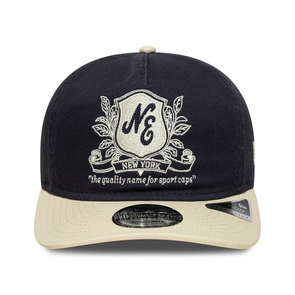 Pictured is this New Era Washed Graphic 19TWENTY cap in navy & cream. 2