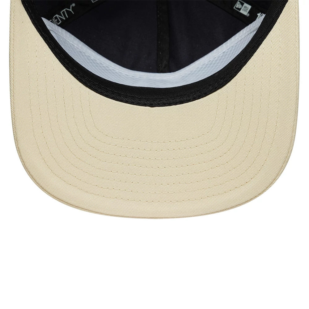 New Era Washed Graphic Navy & Cream 19TWENTY Adjustable Cap, inside view showing the cream undervisor with a black edge, black sweatband, and contrasting white taping, highlighting detailed stitching and seamless construction.