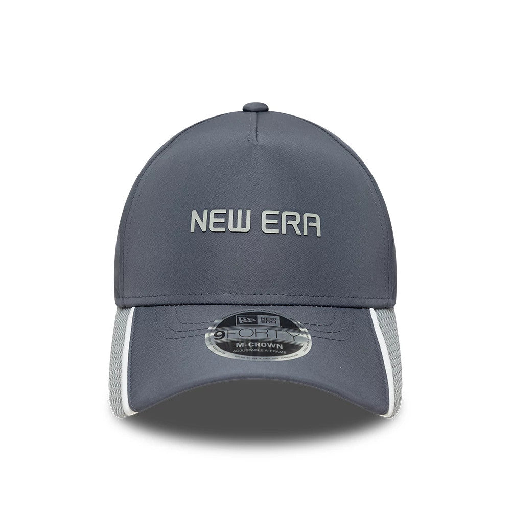 New Era Tech Grey 9FORTY M-Crown A-Frame Adjustable Cap, front view showing a white raised embroidered New Era wordmark on the grey structured crown, a curved grey visor, and a 9FORTY size sticker on the visor.