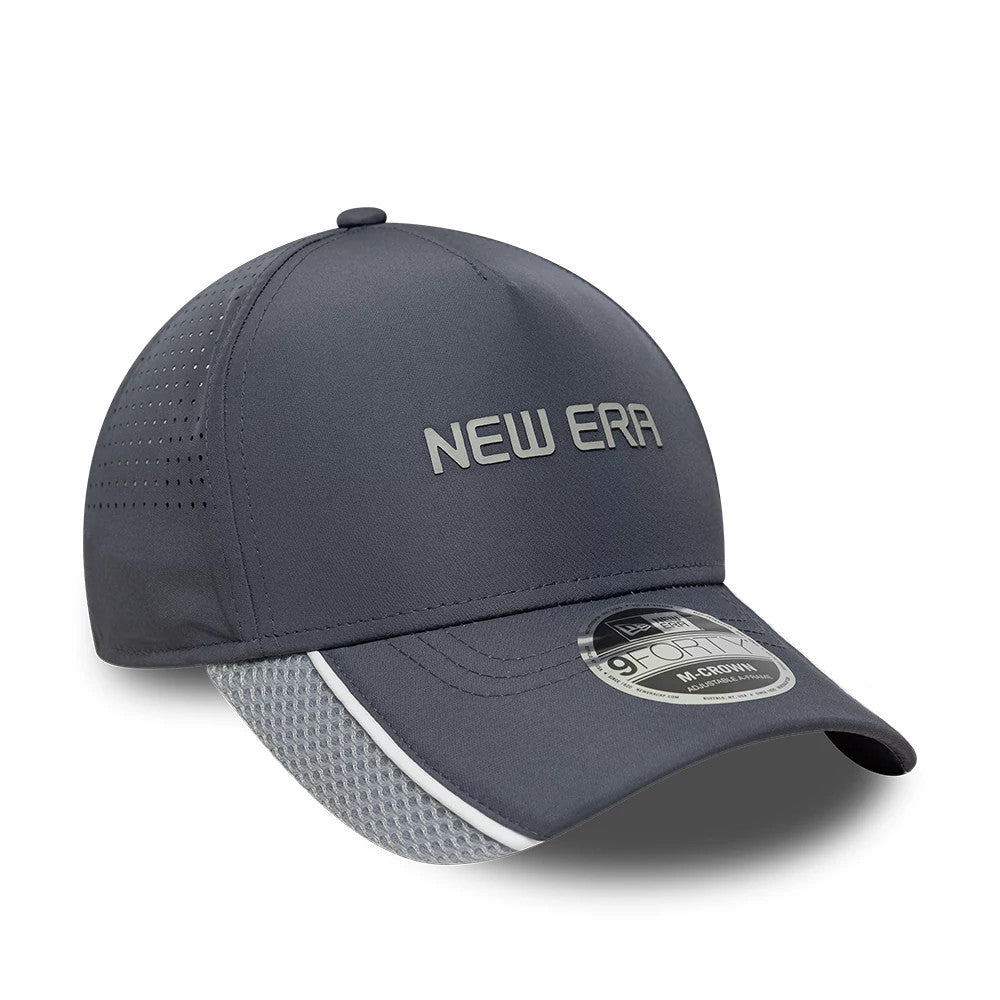 New Era Tech Grey 9FORTY M-Crown A-Frame Adjustable Cap, three-quarter view showing raised New Era text in grey embroidery on the front panel, a side crown, and the 9FORTY size sticker on the curved dark grey visor.