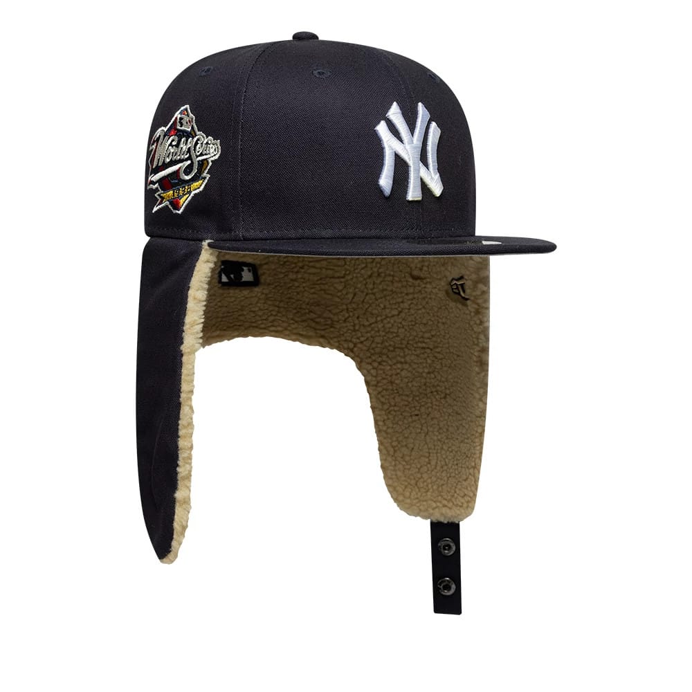 Pictured is this MLB World Series New York Yankees Dogear 59FIFTY Fitted cap in navy. 2