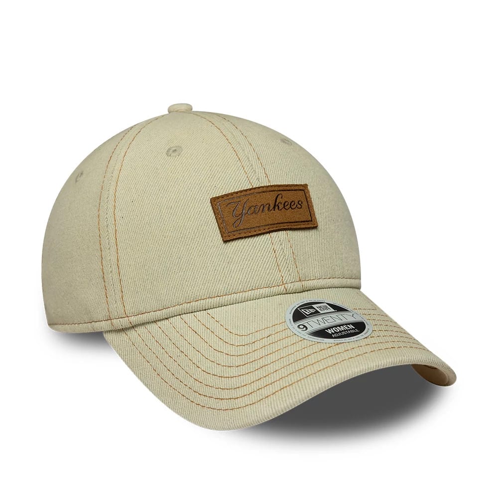 New York Yankees Womens MLB Denim Cream New Era 9TWENTY Adjustable Cap, front view showing a brown Yankees script patch on the cream crown, a curved visor with brown stitching lines, and a 9TWENTY size sticker on the visor.