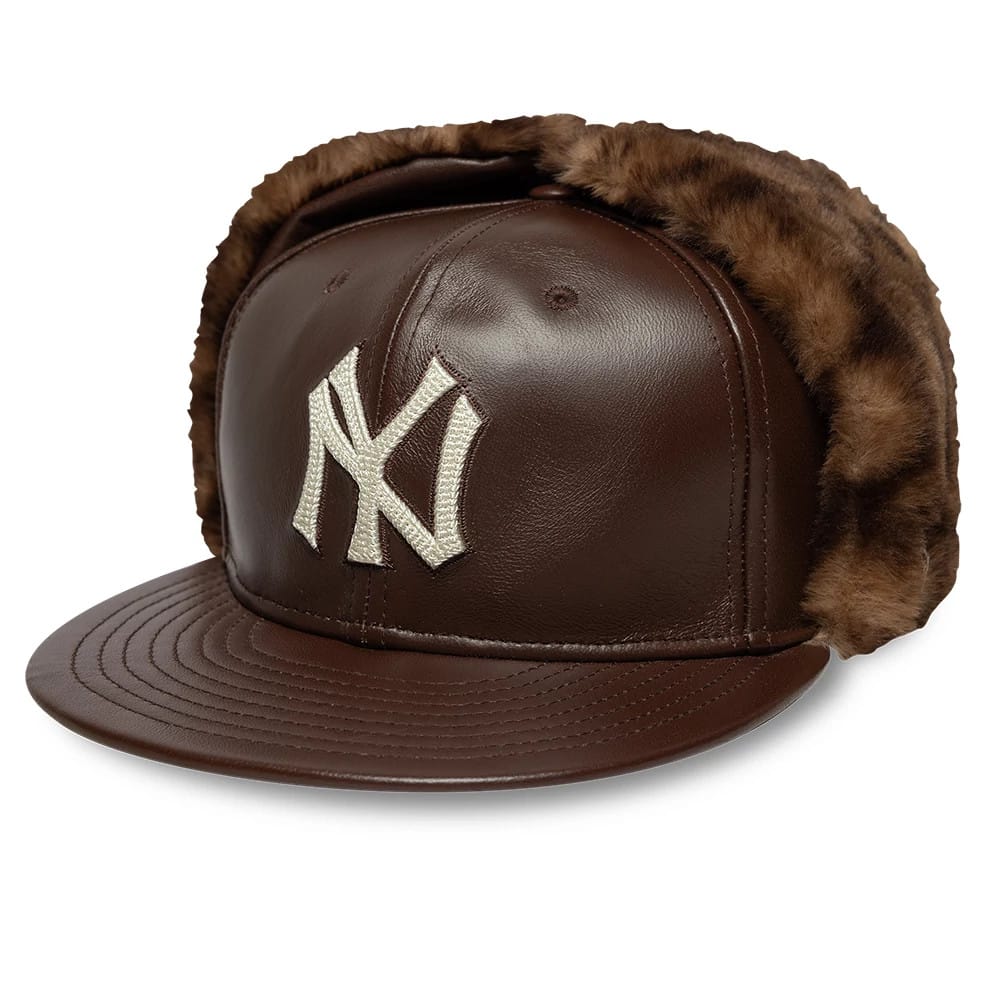 Pictured is this MLB Leather New York Yankees Dogear 59FIFTY Fitted cap in brown. 1