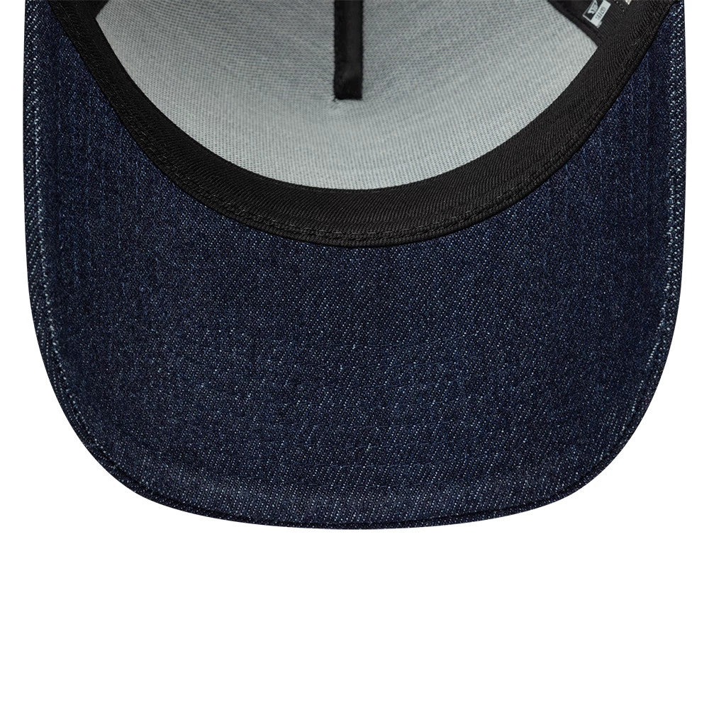 Pictured is this New Era Patch Denim 9FORTY A-Frame Trucker cap in dark blue. 5