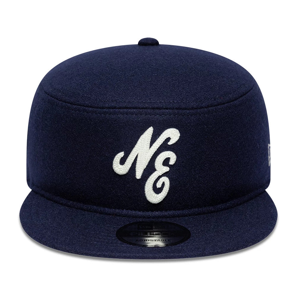 Pictured is this New Era Pin Pillbox Adjustable cap in navy. 2
