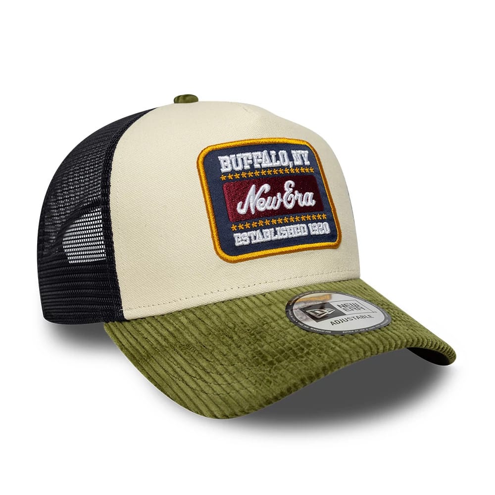 Pictured is this New Era Patch Cord 9FORTY A-Frame Trucker cap in cream & green. 3