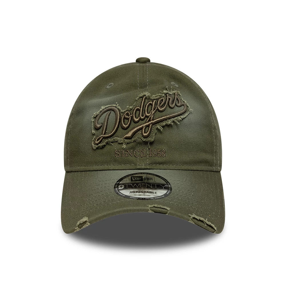 LA Dodgers MLB Distressed Denim Green New Era 9TWENTY Adjustable Cap, front view showing a distressed embroidered Dodgers logo with frayed edges in dark green, a Since 1958 inscription beneath, and a 9TWENTY size sticker on the curved visor.