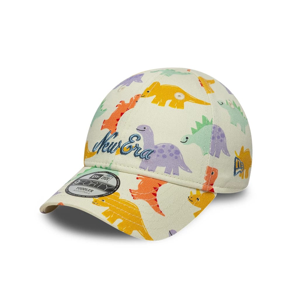 Pictured is this Toddler New Era All Over Dino 9FORTY cap in cream. 1