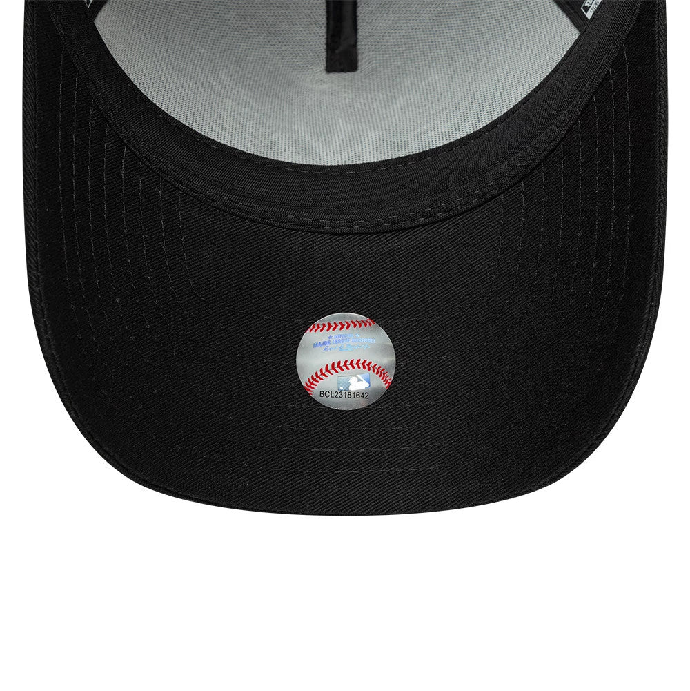 New York Yankees MLB Script Black New Era 9FORTY A-Frame Trucker Adjustable Cap, inside view showing a grey undervisor, the cap lining with stitching along the seams, and a baseball-themed sticker on the black visor.