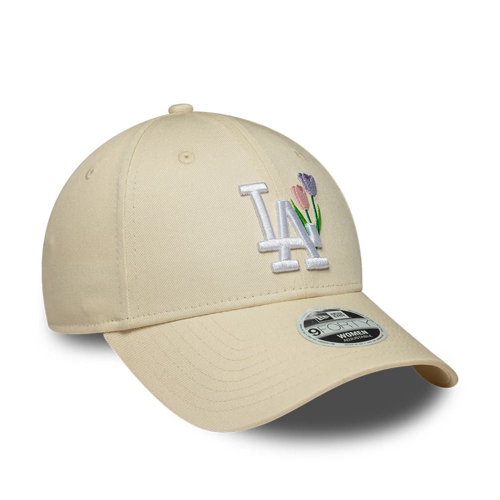 LA Dodgers Womens MLB Flower Icon Cream New Era 9FORTY Adjustable Cap, three-quarter view showing the white LA embroidered logo with pink and purple flower motifs on the front panel, curved cream visor and 9FORTY size sticker.