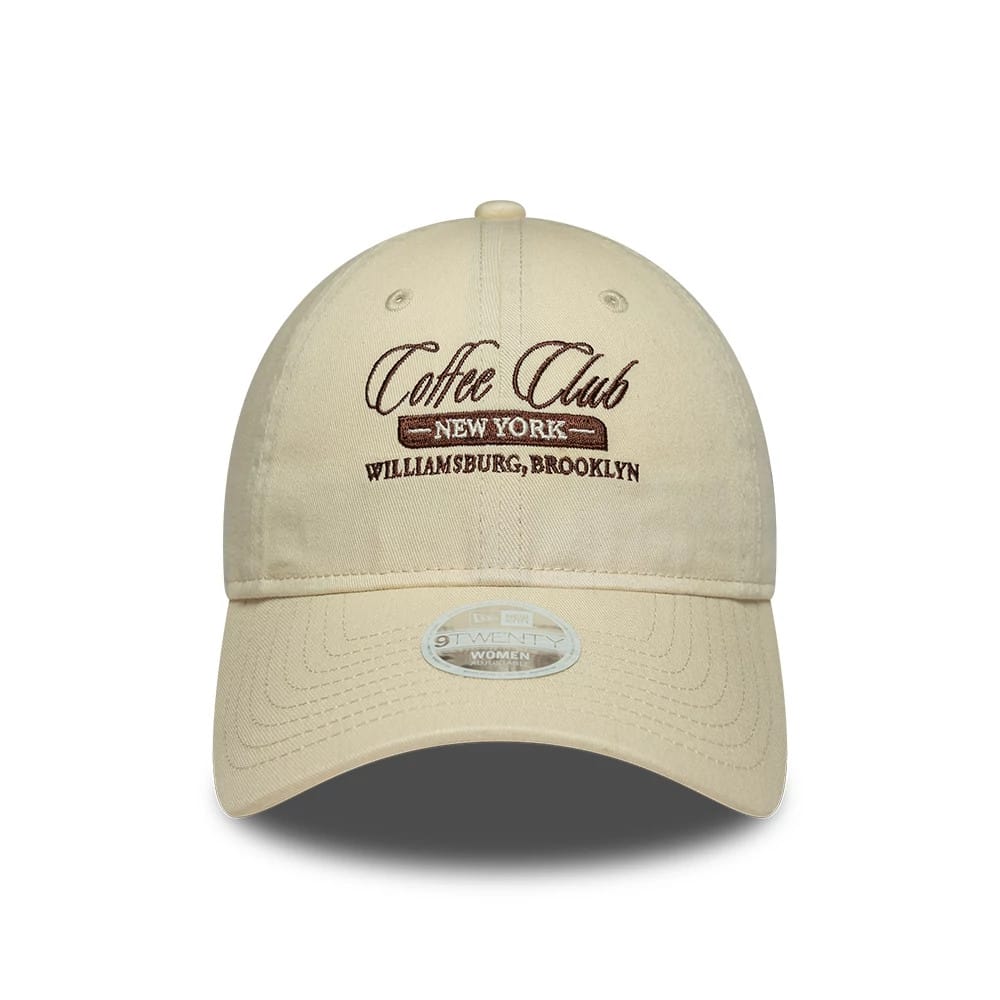 Pictured is this Womens New Era Café Slogan 9TWENTY cap in cream. 2