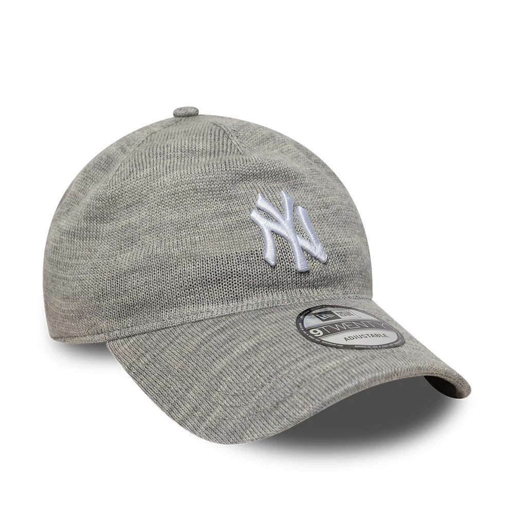New York Yankees MLB Knitted Grey New Era 9TWENTY A-Frame Adjustable Cap, front view showing the raised white embroidered NY logo on the grey knitted crown, curved visor and 9TWENTY size sticker on the top of the visor.