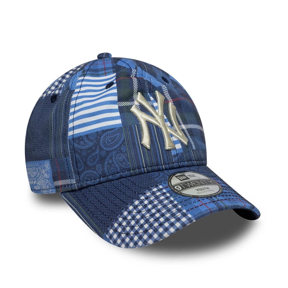 Youth New York Yankees MLB Patchwork Navy New Era 9TWENTY Adjustable Cap, front view showing the ivory raised embroidered NY logo on a patchwork patterned navy crown, with a navy visor and a 9TWENTY size sticker on the visor.