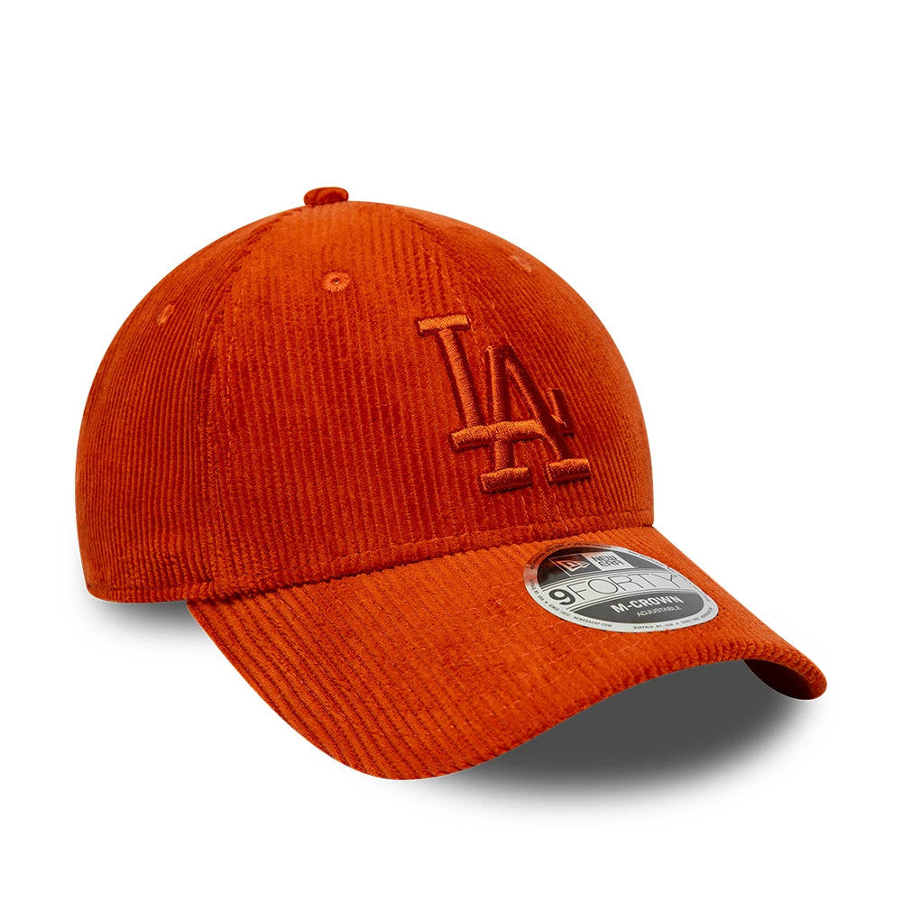 LA Dodgers MLB Cord Red New Era 9FORTY M-Crown Adjustable Cap, three-quarter view showing the red embroidered LA lettering on the front panel, a curved visor with a 9FORTY size sticker, and distinctive corduroy texture across the crown.